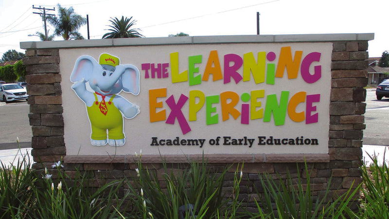 exterior business sign for an educational institution